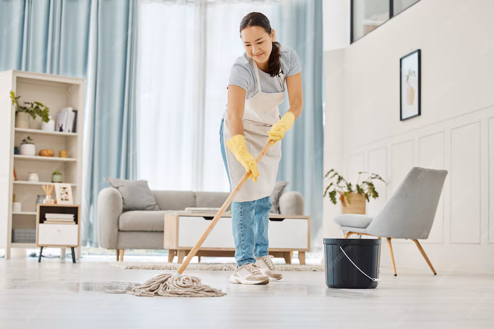 woman cleaning floor with mop living room home with smile happy asian cleaner doing housework job clean lounge hotel room house while smiling alone spring cleaning 590464 85963
